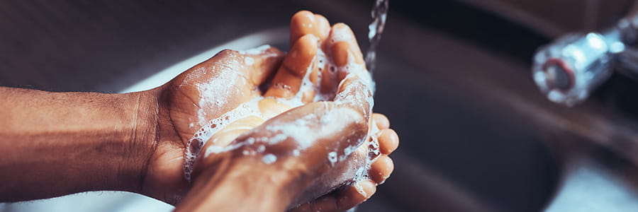 Image of someone washing their hands.