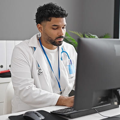 Image of doctor typing.