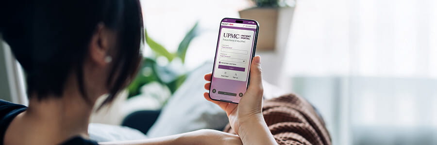Person holding a phone with the Central PA Portal app open. 