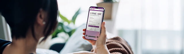 Person holding a phone with the Central PA Portal app open. 