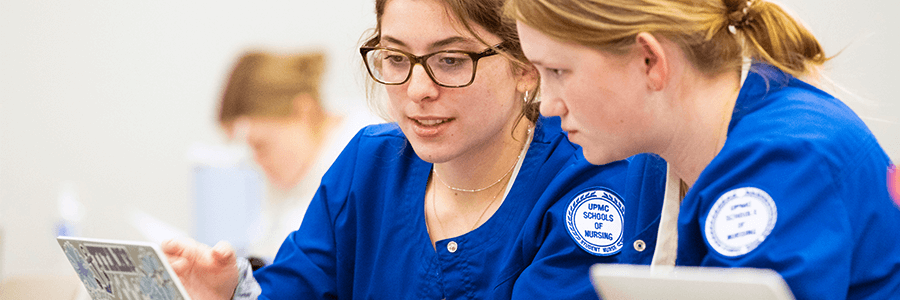 Banner includes image of two students talking.