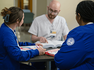 Image of students working together.