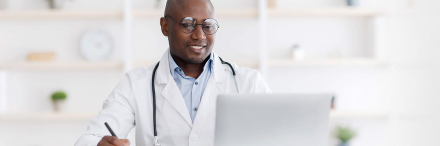 Image of doctor on computer.