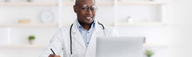 Image of doctor on computer.