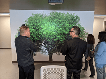 The artist meeting with providers and staff who will work on the second floor.