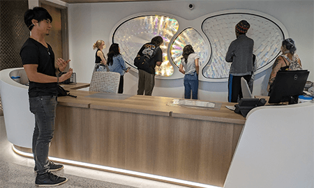 The artist, front left, giving a tour of the artwork to students from the Kentucky College of Art + Design.