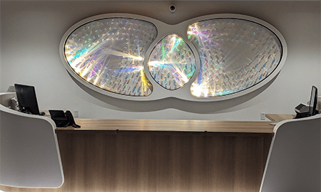 LED lights inside artwork of intersecting ovals representing how the rods and cones within the retina perceive light.