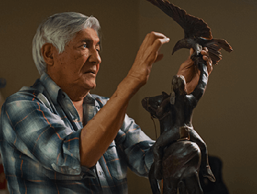 Michael Naranjo sculpts a bird.