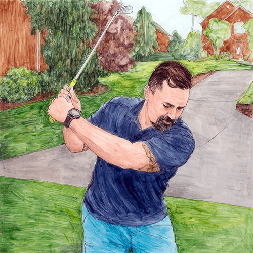 A man swings a golf club.