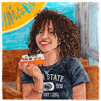 Cheyenne Hennen holds a miniature Volkswagen bus in her right hand. 