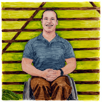 Dan McCoy sits in a wheelchair in front of a green background.