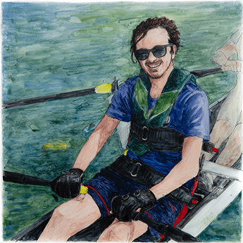 Jackson sits in a boat holding the oars and smiling. 