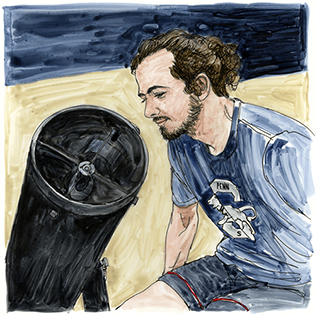 Jackson sits beside a telescope.