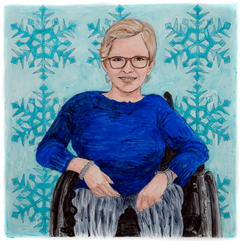 Laurie sits in her wheelchair in front of a background of blue snowflakes.