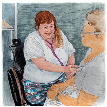 Monica Albert Sill, seated in a wheelchair, checks a patient’s heartbeat.