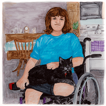 Shirley Nedzesky sits in a wheelchair in front of a table and stove with a black cat on her lap. 