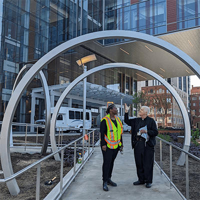 Shervone Neckles asked Father Albie Schempp to bless The Lunar Portal when the installation was completed.