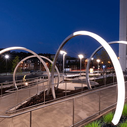 Ten-foot-tall archways made of stainless steel and acrylic installed outside of the UPMC Mercy Pavilion.  Learn more about The Lunar Portal by Shervone Neckles.