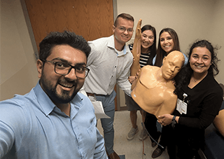 Picture of residents listening to lecture.