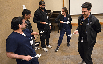 Residents play a game during Halloween.