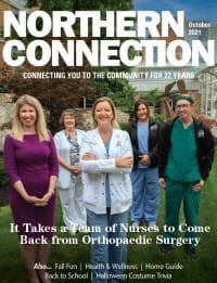 The UPMC Passavant orthopaedic surgery team stands together posing for the cover of Northern Connection Magazine. 