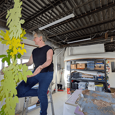 The artist assembled each of the branches in her studio and suspended them from the ceiling. 