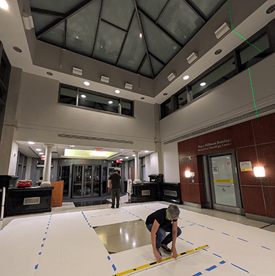 To find the exact attachment points of each branch in the atrium, the artist created a template of the ceiling on the floor and then used a laser to identify the exact locations. 