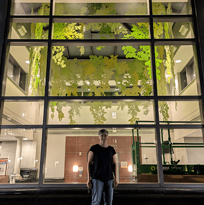 Artwork complete. On the last night of the installation, the team viewed the sculpture from the garden and reflected on how beautiful it is to see the colorful branches framed by the windows.