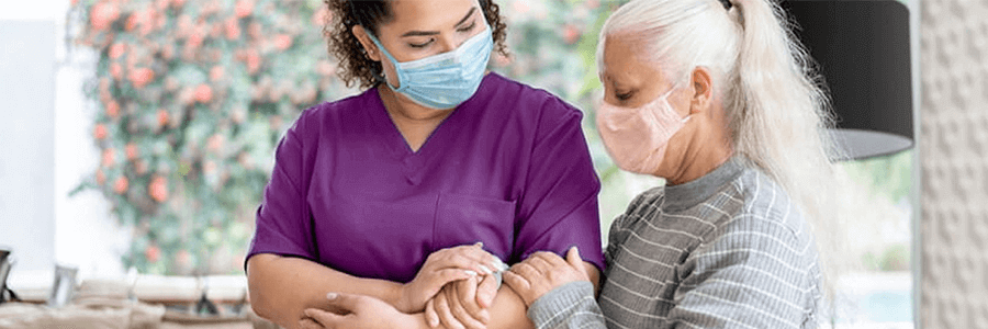 Image of hospice worker with patient.