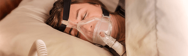 Image of woman sleeping with mask.