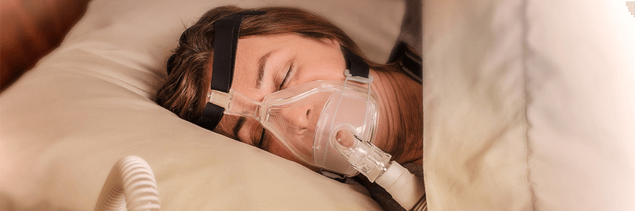 Image of woman sleeping with a cpap.