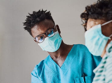 Image of nurse talking to a patient.