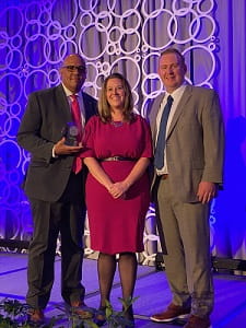 Jarrod Johnson, president of UPMC Carlisle; Mandy Martin, CNO, VP of patient care; Patrick Lundquist, director of operations receiving the Leapfrog Top Hospital award.
