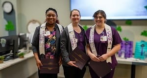 Shanda Neal, Lisa Armour, and Kaitlynne Green celebrate as the first graduates from UPMC’s MA program in central Pa.