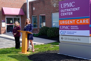 Lisa Cain, left, chief nursing officer and vice president of patient care services, UPMC Memorial, and Sarah Kirby, right, chief operating officer, OIP, deliver remarks at a ribbon cutting ceremony for OIP’s first outpatient orthopaedics clinic in York County.