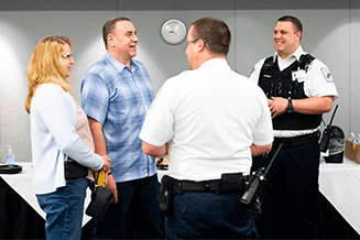Bill and the EMS clinicians from Susquehanna Regional EMS share smiles during the Save-A-Life Day reunion event at UPMC Williamsport.
