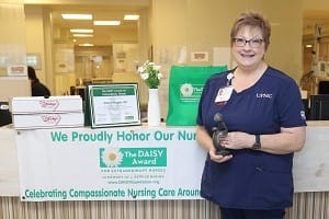 DAISY winner Cheryl Hopple, RN, Emergency Department, UPMC Muncy, is pictured with her award.