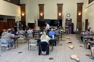 As part of the UPMC Minutes Matter training, coaches, volunteers, and parents participated in classroom-style information sessions in addition to hands-on training for skills like AED use, applying a tourniquet, conducting effective hands-only CPR, and techniques for responding to mental health crises.