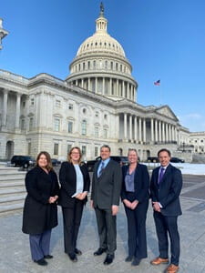 Patti Jackson-Gehris, market president, UPMC North Central Pa., poses with other hospital system leaders in front of the Capital Building during their trip to Washington D.C. to advocate for affordable care in rural communities.