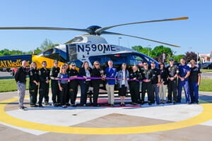 Staff from UPMC Muncy and STAT MedEvac gather on the helipad at UPMC Muncy for a ribbon-cutting ceremony, marking the start of critical care helicopter operations in northcentral Pennsylvania.