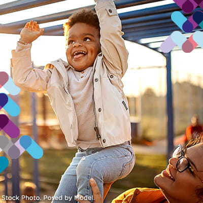 Child services callout. Image of child on monkey bars.