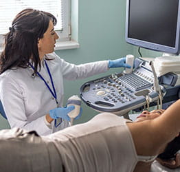 Doctor performs scan on patient