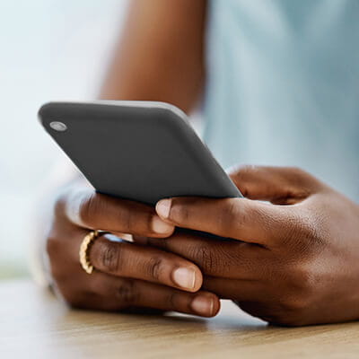 Image of woman holding phone.