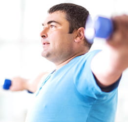 Man exercises with weights