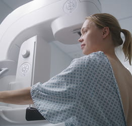 Woman receiving mammogram