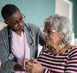 Nurse assisting patient