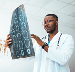Doctor examining brain scans