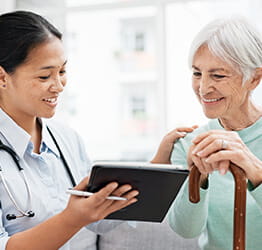 Doctor discusses chart with patient