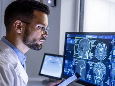 Doctor looking at brain scans