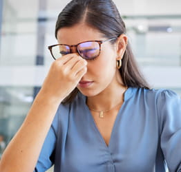 Photo of a woman with a headache.
